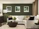 Inviting living room with an oversized couch, decorative pillows, and bright natural light at 109 Dogwood Grove Pl, Troutman, NC 28166