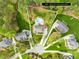Aerial view of the home showcasing the pool, the 0.68 acre lot, and the surrounding neighborhood at 113 Sandy Cove Ct, Mooresville, NC 28117
