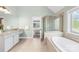 Open-concept Primary bath featuring tub, shower, and separate vanities at 113 Sandy Cove Ct, Mooresville, NC 28117