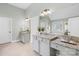 Primary bathroom with double sink vanity and granite countertops at 113 Sandy Cove Ct, Mooresville, NC 28117