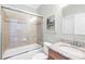 Bathroom with a shower-tub combination, granite countertop, and tile surround at 113 Sandy Cove Ct, Mooresville, NC 28117