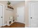 Welcoming entryway with bench, storage, and neutral color palette at 113 Sandy Cove Ct, Mooresville, NC 28117