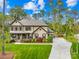 Inviting two-story home with a well-kept lawn and traditional architectural details at 113 Sandy Cove Ct, Mooresville, NC 28117