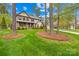 Beautiful home with a well-maintained lawn and mature trees in the front yard at 113 Sandy Cove Ct, Mooresville, NC 28117