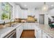 Updated kitchen features granite countertops, stainless steel appliances, and ample storage at 113 Sandy Cove Ct, Mooresville, NC 28117