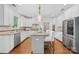 Modern kitchen with white cabinets, granite countertops, and stainless steel appliances at 113 Sandy Cove Ct, Mooresville, NC 28117