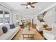Bright, open living room flows into kitchen with modern fixtures and staircase at 113 Sandy Cove Ct, Mooresville, NC 28117