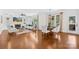 Open concept living and dining area with fireplace and natural light at 113 Sandy Cove Ct, Mooresville, NC 28117