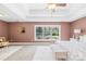 Generously sized primary bedroom with a bench seat and neutral tones at 113 Sandy Cove Ct, Mooresville, NC 28117