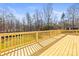 Large wooden deck with railing, perfect for outdoor entertaining and enjoying the backyard view at 1173 Yorkdale Ln, Lincolnton, NC 28092