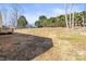 A shadow falls across the big backyard and deck of this new construction home at 1173 Yorkdale Ln, Lincolnton, NC 28092