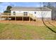 Spacious backyard featuring a newly constructed wooden deck, stairs, and a serene outdoor setting at 1173 Yorkdale Ln, Lincolnton, NC 28092