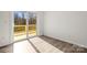 A bedroom with sliding glass doors to a deck at 1173 Yorkdale Ln, Lincolnton, NC 28092