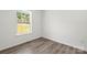 A bright bedroom with a large window and hardwood floors at 1173 Yorkdale Ln, Lincolnton, NC 28092