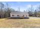 Charming single story home with light siding and new deck in a serene wooded setting at 1173 Yorkdale Ln, Lincolnton, NC 28092