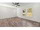 Open living room featuring modern ceiling fan and large windows, creating a bright and airy atmosphere at 1173 Yorkdale Ln, Lincolnton, NC 28092