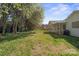Green backyard with trees and well-maintained lawn, offering a tranquil setting for relaxation and outdoor enjoyment at 1207 Overhill Rd, Salisbury, NC 28144