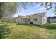 White home with a well-manicured backyard, patio area, and lush greenery providing a private and serene outdoor space at 1207 Overhill Rd, Salisbury, NC 28144