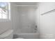 Spotless bathroom has a shower-tub combo with tile surround, offering relaxation or quick refreshing experience at 1207 Overhill Rd, Salisbury, NC 28144