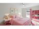 Staged bedroom featuring pink decor, a plush rug, and a window that lets in natural light at 1207 Overhill Rd, Salisbury, NC 28144