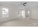 Bedroom with carpet flooring, a ceiling fan, and a pair of windows at 1207 Overhill Rd, Salisbury, NC 28144