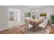 Staged dining room featuring a light wood table, seating for six, and artwork in the background at 1207 Overhill Rd, Salisbury, NC 28144