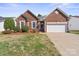 Charming brick home with a two-car garage and well-maintained landscaping at 1207 Overhill Rd, Salisbury, NC 28144