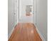 Hallway with hardwood floors and view into room with carpet at 1207 Overhill Rd, Salisbury, NC 28144