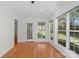Bright living room with hardwood floors, featuring large windows and access to the backyard at 1207 Overhill Rd, Salisbury, NC 28144