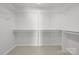 Spacious walk-in closet offers ample storage with shelving and hanging rods for organization and convenience at 1207 Overhill Rd, Salisbury, NC 28144