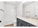 Bathroom with shower-tub combo, light countertops, dark cabinets, and hardwood-style floors at 1540 Solitude Ct, Kannapolis, NC 28081
