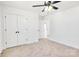 Carpeted bedroom with a ceiling fan and a closet at 1540 Solitude Ct, Kannapolis, NC 28081
