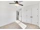 Bedroom with ceiling fan, neutral carpet, white walls, and standard-sized closet at 1540 Solitude Ct, Kannapolis, NC 28081