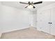 Bedroom with ceiling fan, neutral carpet, white walls, closet and bathroom entrances at 1540 Solitude Ct, Kannapolis, NC 28081