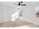 Bedroom featuring neutral carpet, white walls, a ceiling fan and a double window view at 1540 Solitude Ct, Kannapolis, NC 28081