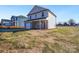 Two story home with attached garage, brick accents, and unfinished landscaping at 1540 Solitude Ct, Kannapolis, NC 28081