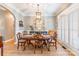 Elegant dining room with hardwood floors, crown molding, and a window with plantation shutters at 1655 Essex Hall Dr, Rock Hill, SC 29730