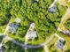 Aerial view of community, showing houses on tree-lined lots and streets at 174 Logan Crossing Dr, Davidson, NC 28036
