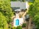 Aerial view of home showcasing lush landscaping, pool, deck, and backyard at 174 Logan Crossing Dr, Davidson, NC 28036