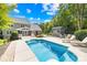 Backyard featuring a sparkling swimming pool with chairs, lounge chairs, and shed at 174 Logan Crossing Dr, Davidson, NC 28036