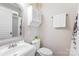 Bright bathroom featuring a white vanity, toilet, and medicine cabinet at 174 Logan Crossing Dr, Davidson, NC 28036