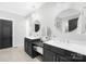 Elegant bathroom with double sinks, modern fixtures, and decorative mirrors at 174 Logan Crossing Dr, Davidson, NC 28036