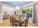 Dining room with natural light, hardwood floors, and decorative chandelier at 174 Logan Crossing Dr, Davidson, NC 28036