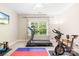 This exercise room is spacious and has natural light at 174 Logan Crossing Dr, Davidson, NC 28036