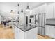 Eat-in kitchen featuring stainless steel appliances, a kitchen island and lots of natural light at 174 Logan Crossing Dr, Davidson, NC 28036