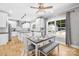 Open concept kitchen with a dining table, stainless appliances and a view of the backyard at 174 Logan Crossing Dr, Davidson, NC 28036