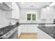 Well-equipped kitchen with stainless steel appliances, gas range and stylish subway tile backsplash at 174 Logan Crossing Dr, Davidson, NC 28036