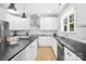 Modern kitchen with stainless steel appliances, stylish pendant lights, and ample counter space at 174 Logan Crossing Dr, Davidson, NC 28036