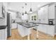 Updated kitchen with a center island, stainless steel appliances, and sleek pendant lighting at 174 Logan Crossing Dr, Davidson, NC 28036