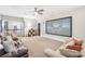 Spacious living room with a large screen and comfortable seating area at 174 Logan Crossing Dr, Davidson, NC 28036